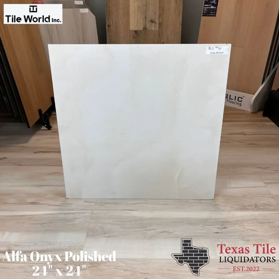 A single square white Alfa Onyx polished tile displayed on a showroom floor.