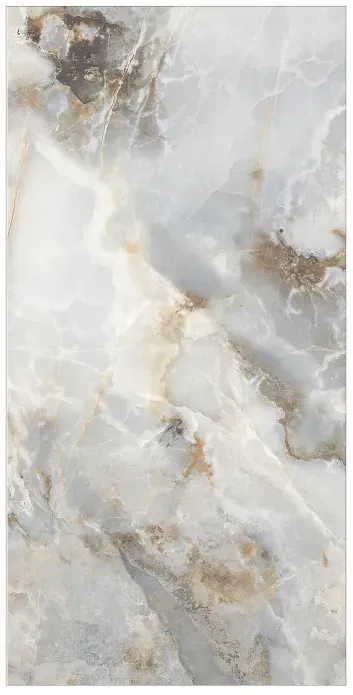 A polished stone surface featuring swirling patterns of white, grey, and golden-brown veins in an onyx marble style.