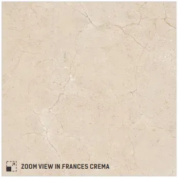 Close-up of a Frances Crema tile, featuring a smooth, beige surface with subtle, light-colored marble veining.