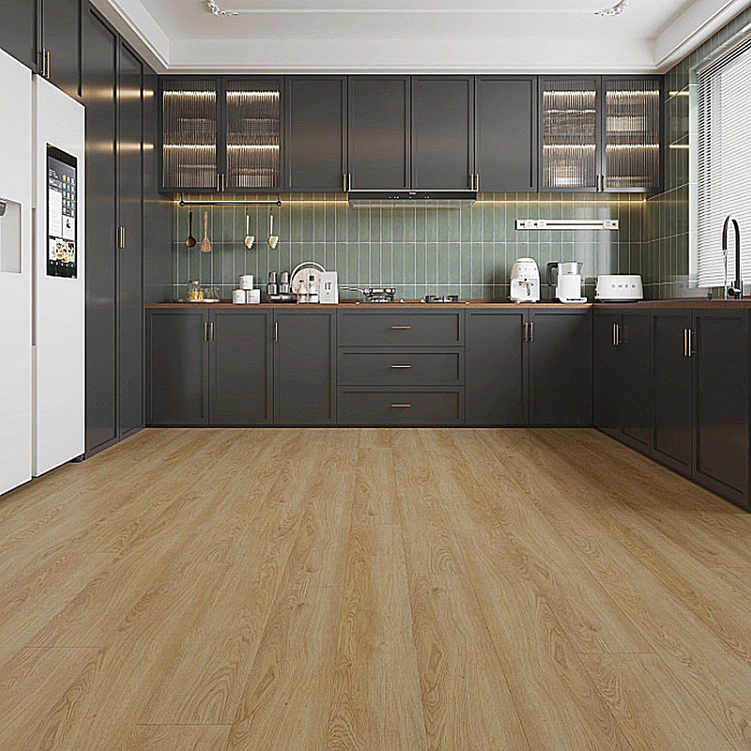 A modern kitchen with dark grey cabinetry, wood-look flooring, light green tiled backsplash, and a white refrigerator.