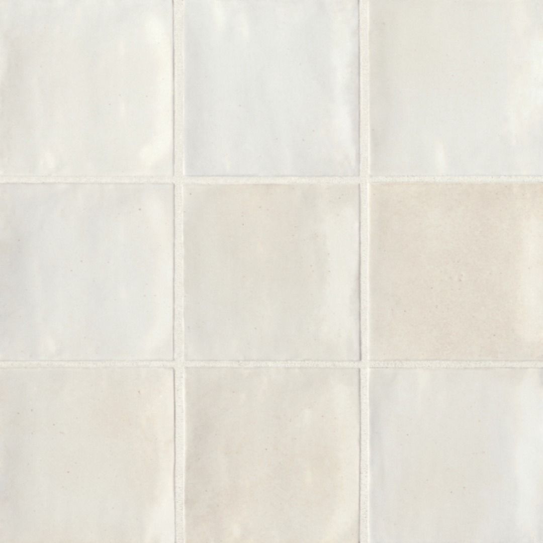 A grid of nine square, glossy, off-white ceramic wall tiles with slightly uneven, handmade-style edges.