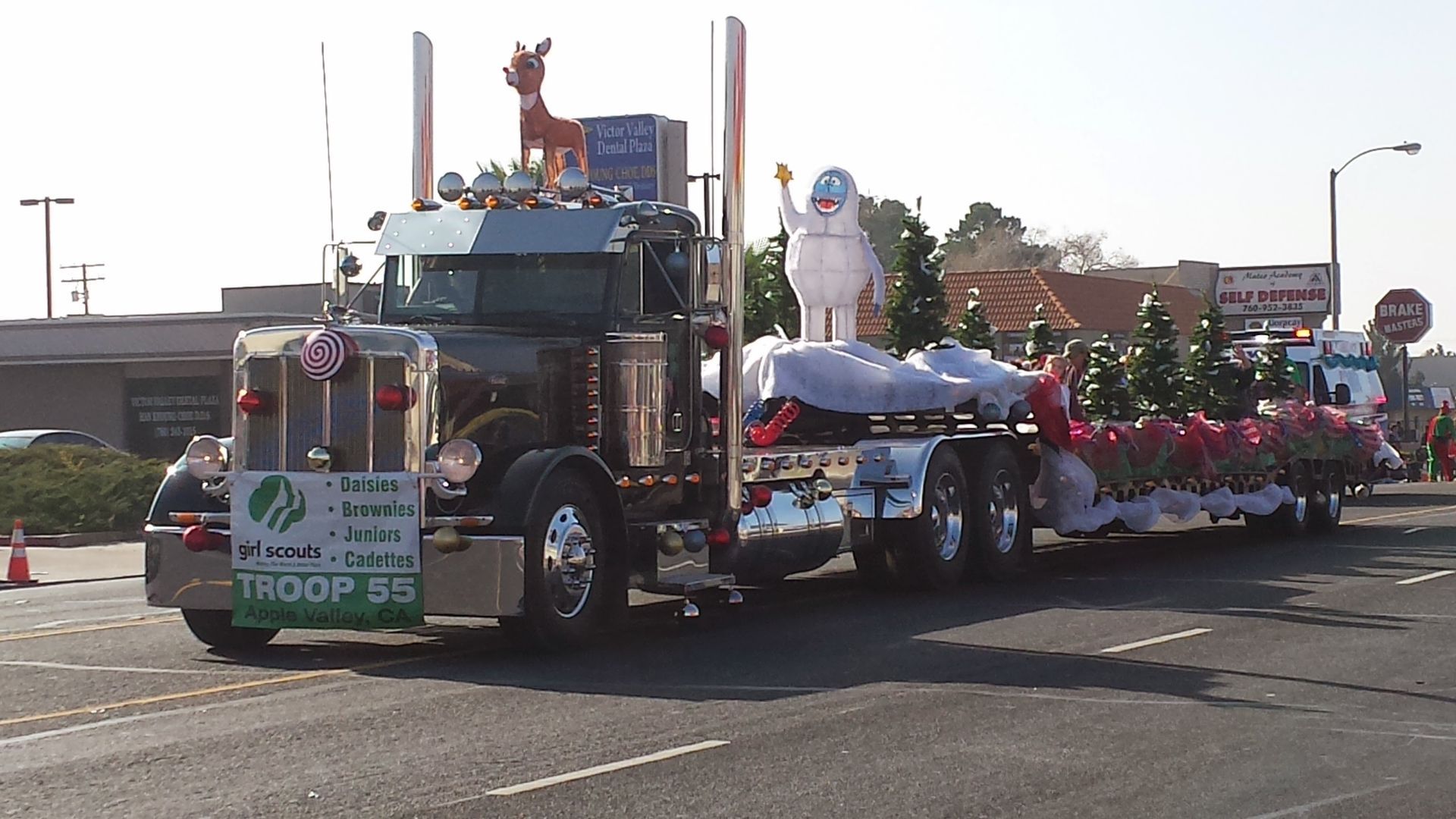 A truck with a sign that says troop 55 on it.