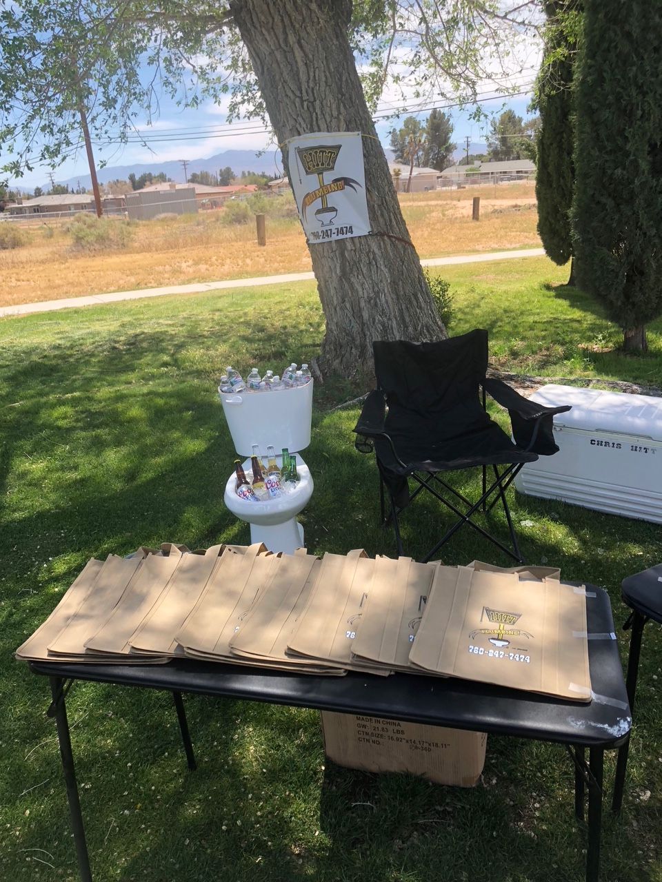 A table with a toilet and a chair on it.