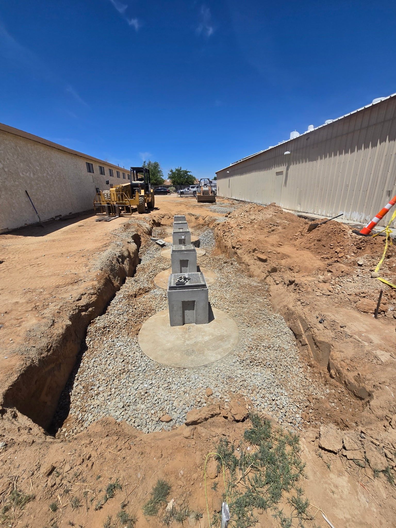 A construction site with a concrete block in the middle of it.