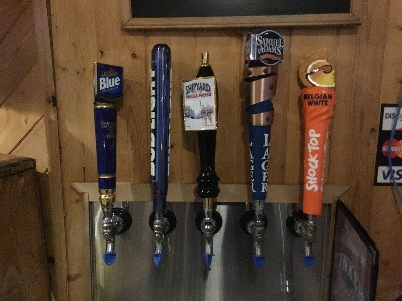 A row of beer taps including one that says shock top