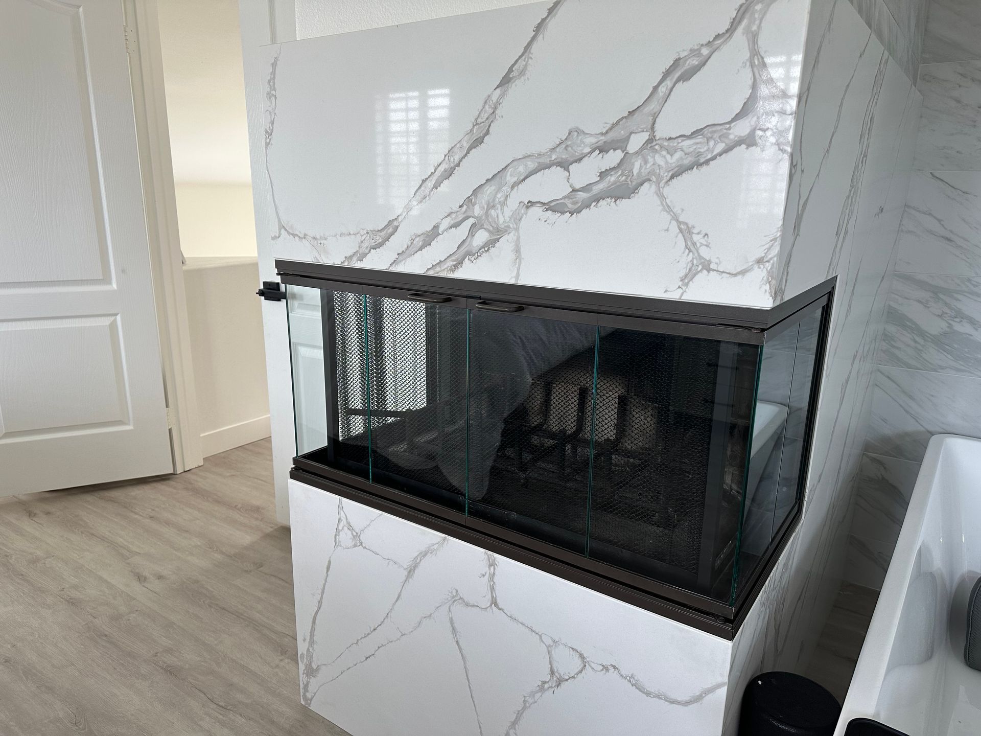 There is a fireplace in the middle of the room.