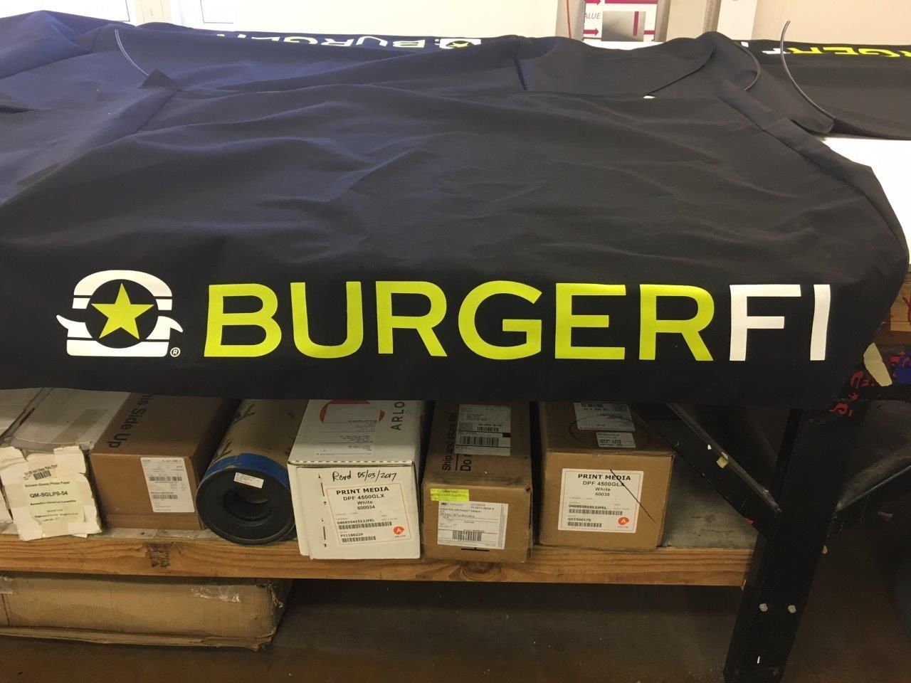 A black shirt with the word burgerfi on it