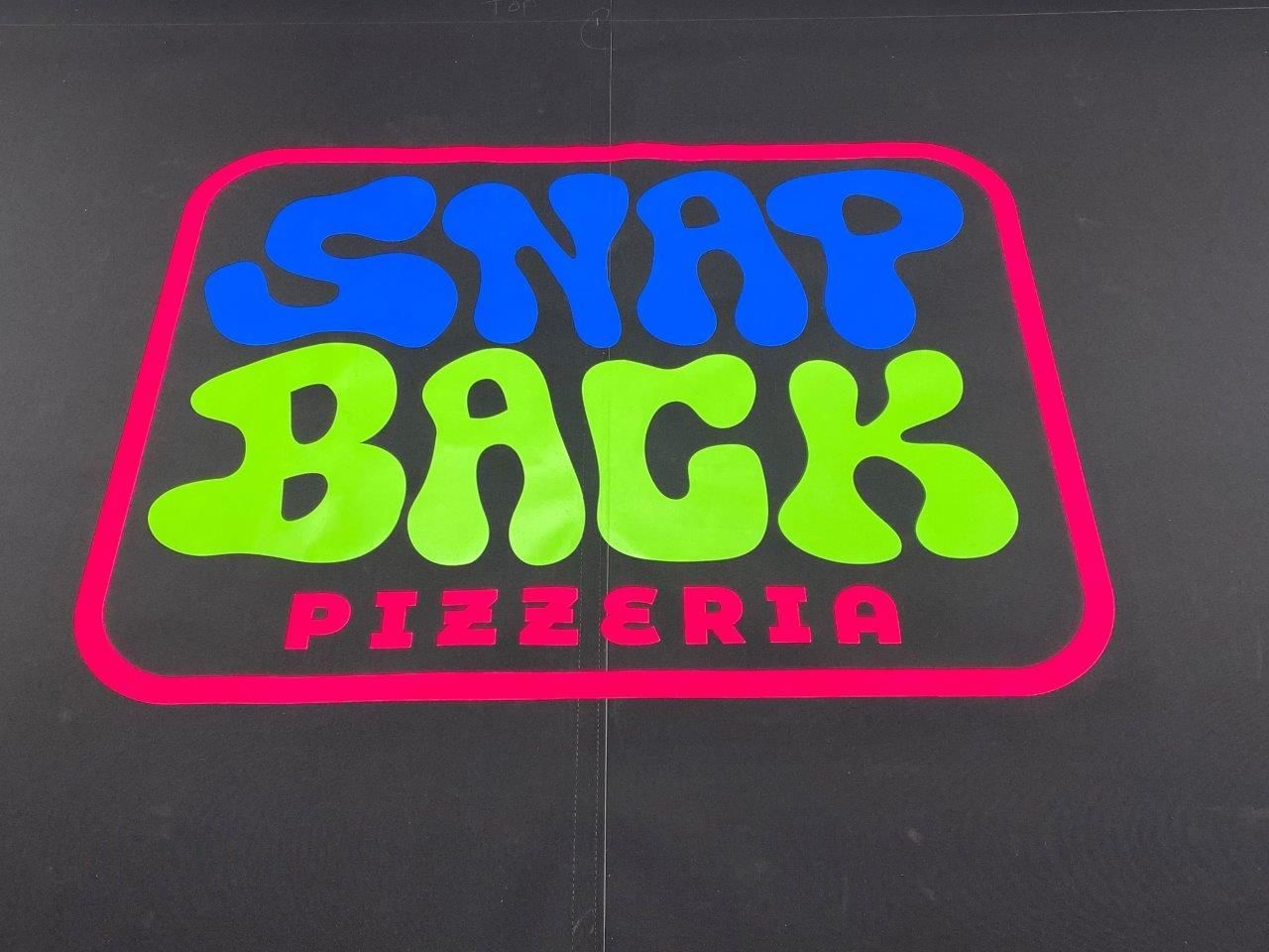 A neon sign for snap back pizzeria