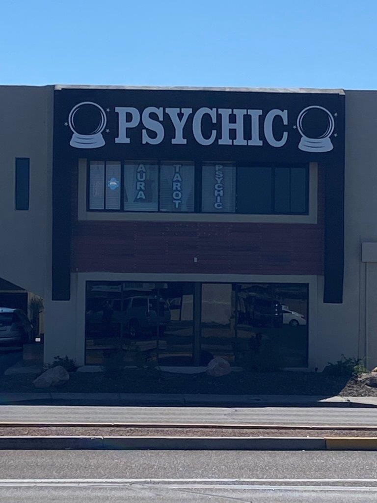 A building with a sign that says psychic on it