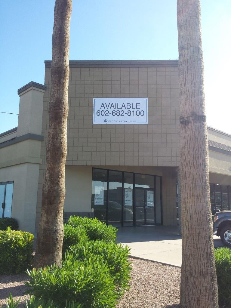 A building with a sign that says available on it