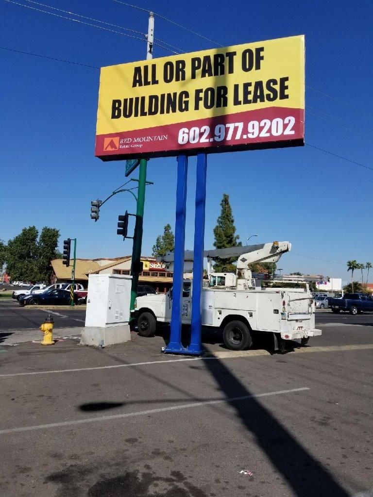 A billboard that says all or part of building for lease