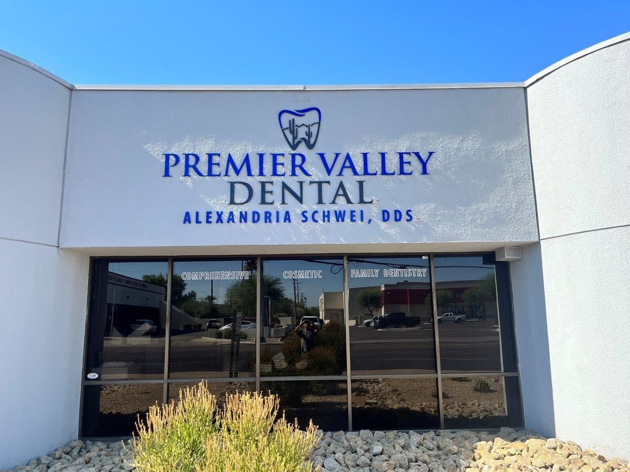 A building with a sign that says premier valley dental