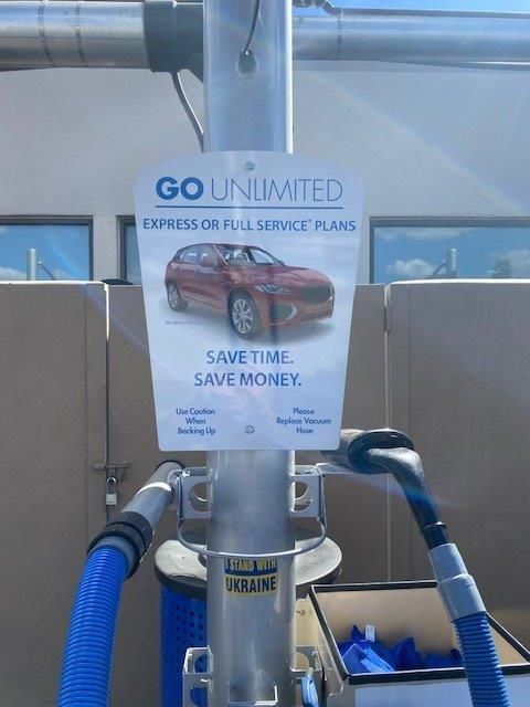A sign that says go unlimited express or full service plans
