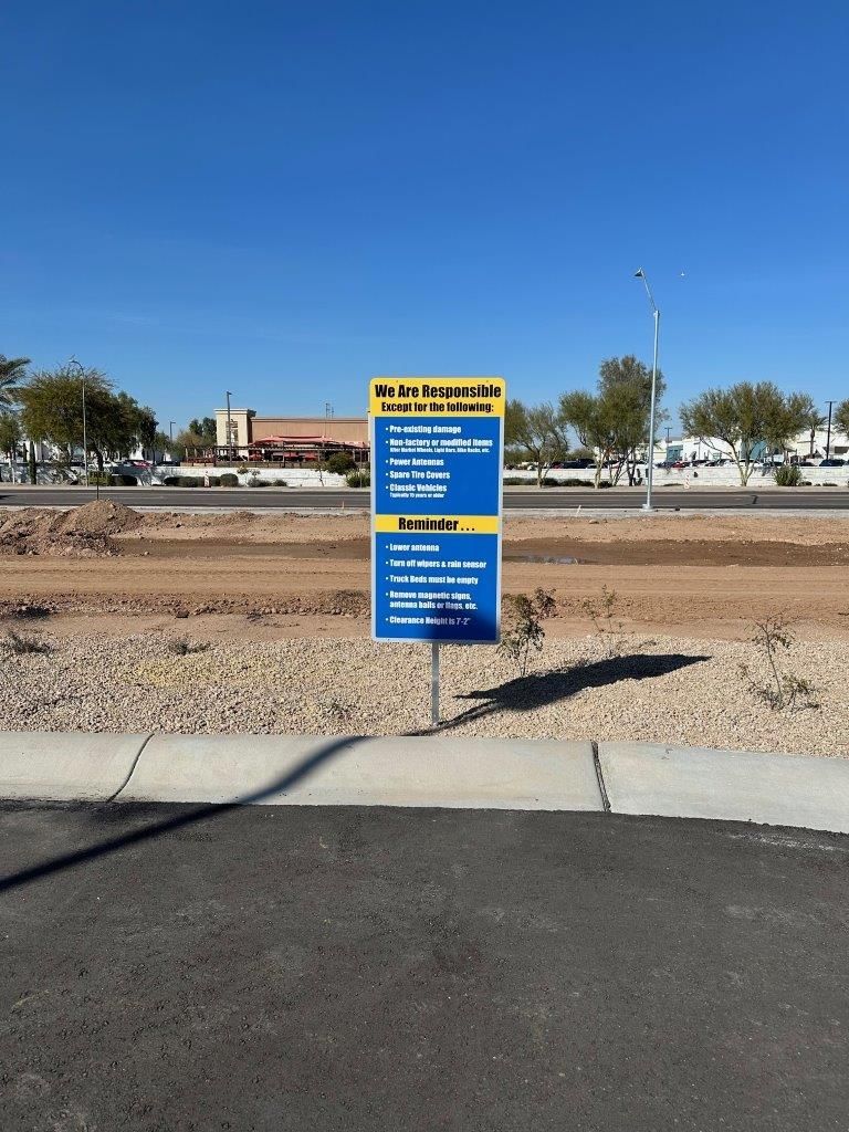 A sign on the side of a road that says 'for sale ' on it