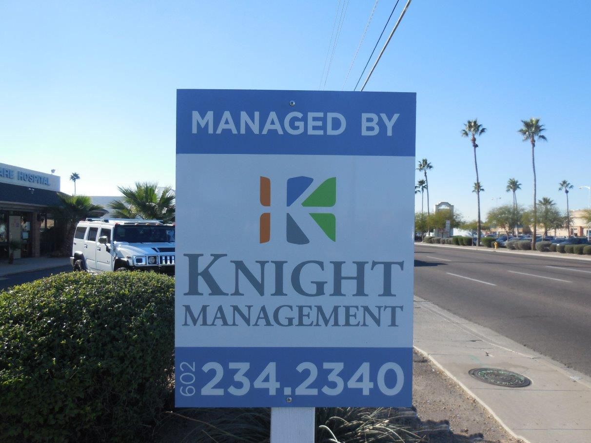 A sign that says managed by knight management on it