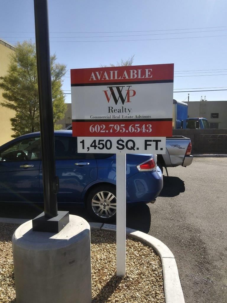A red and white sign that says available on it