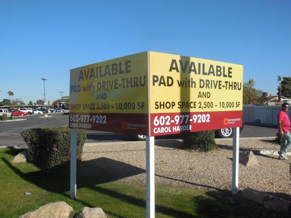 A sign that says available pad with drive thru and shop space
