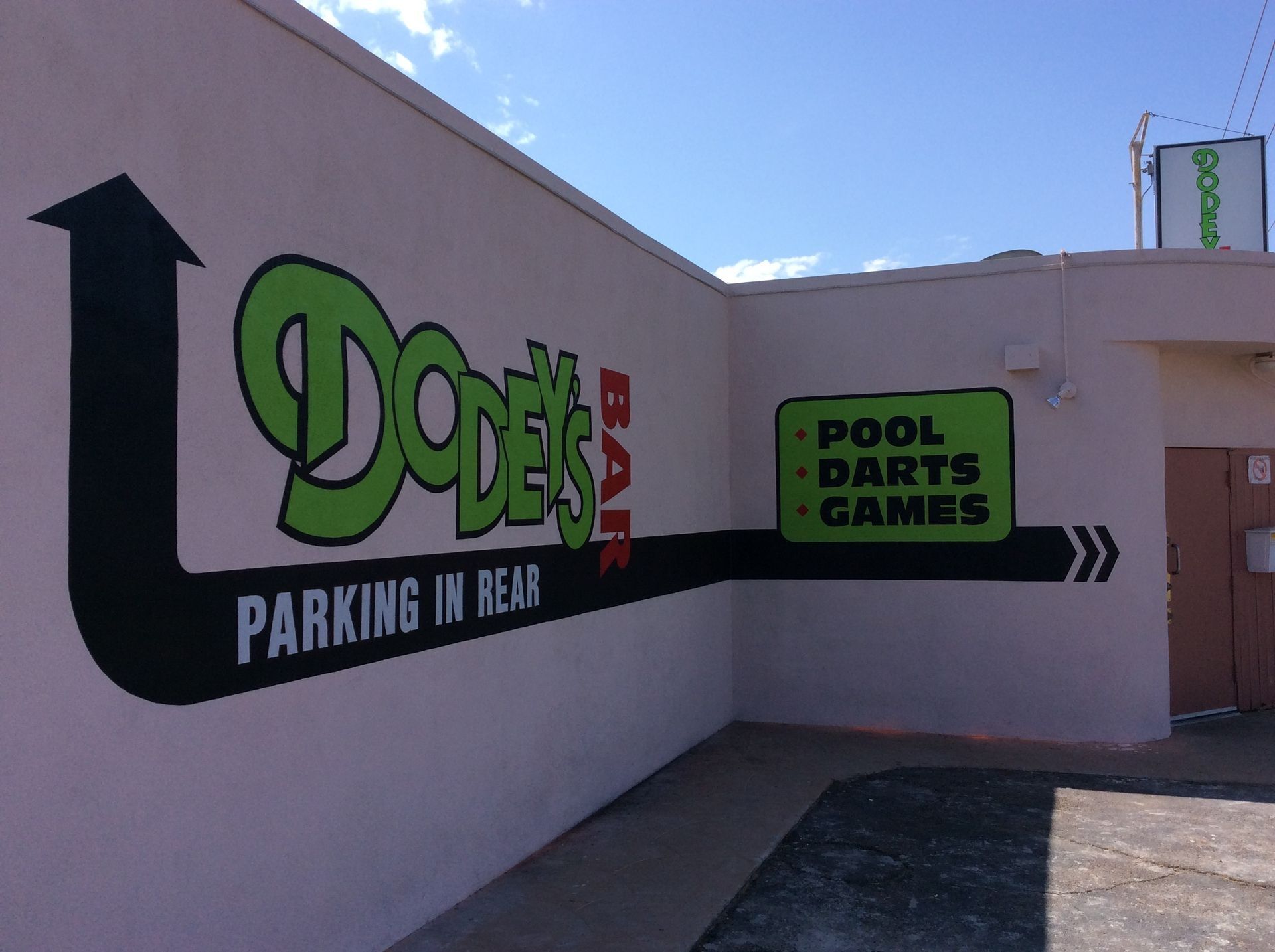 A sign on the side of a building that says