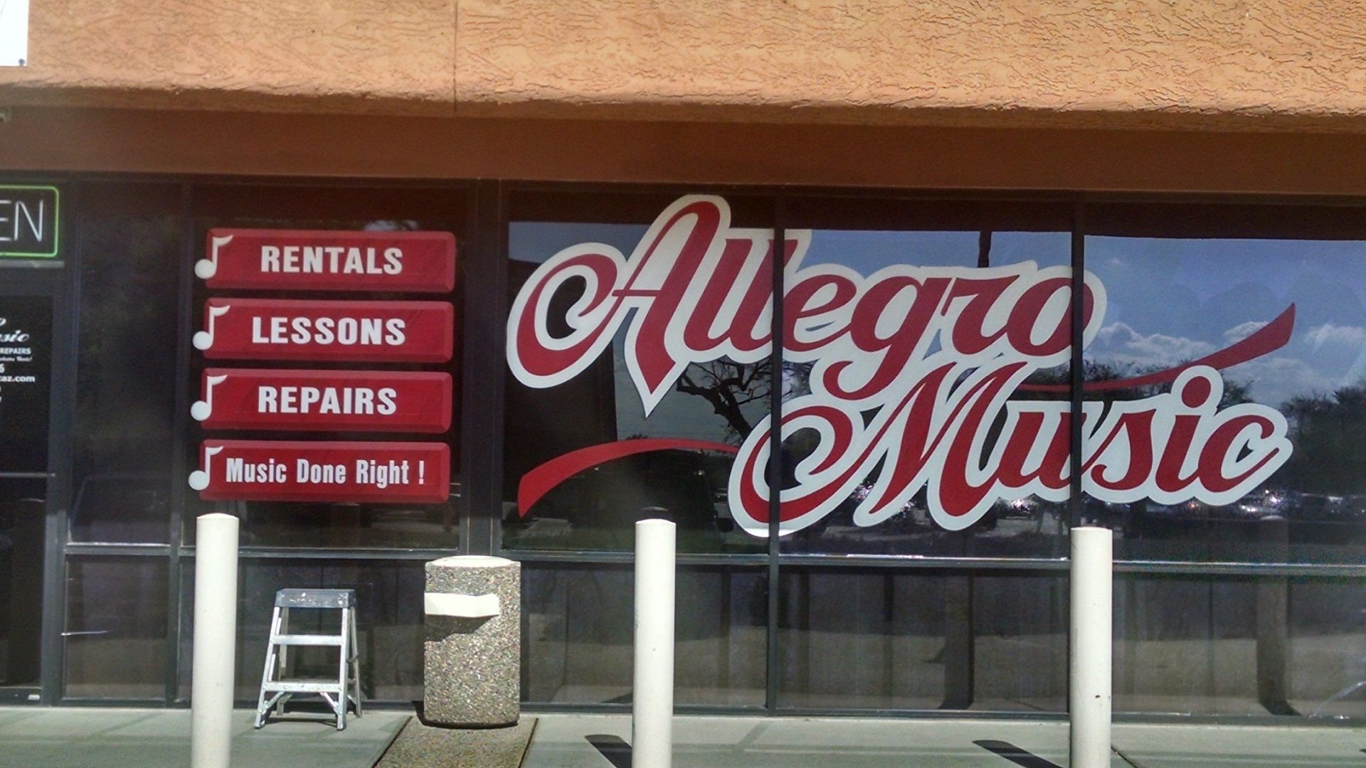 hand-painted red and white sign for Allegro Music