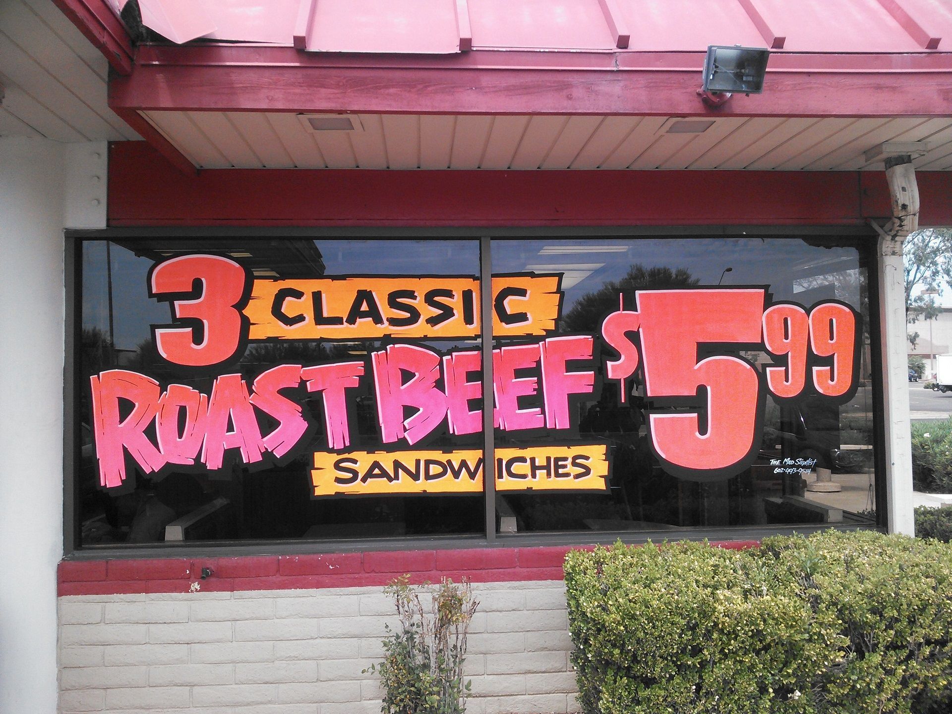 hand-painted sign advertising 3 roast beef for $5.99