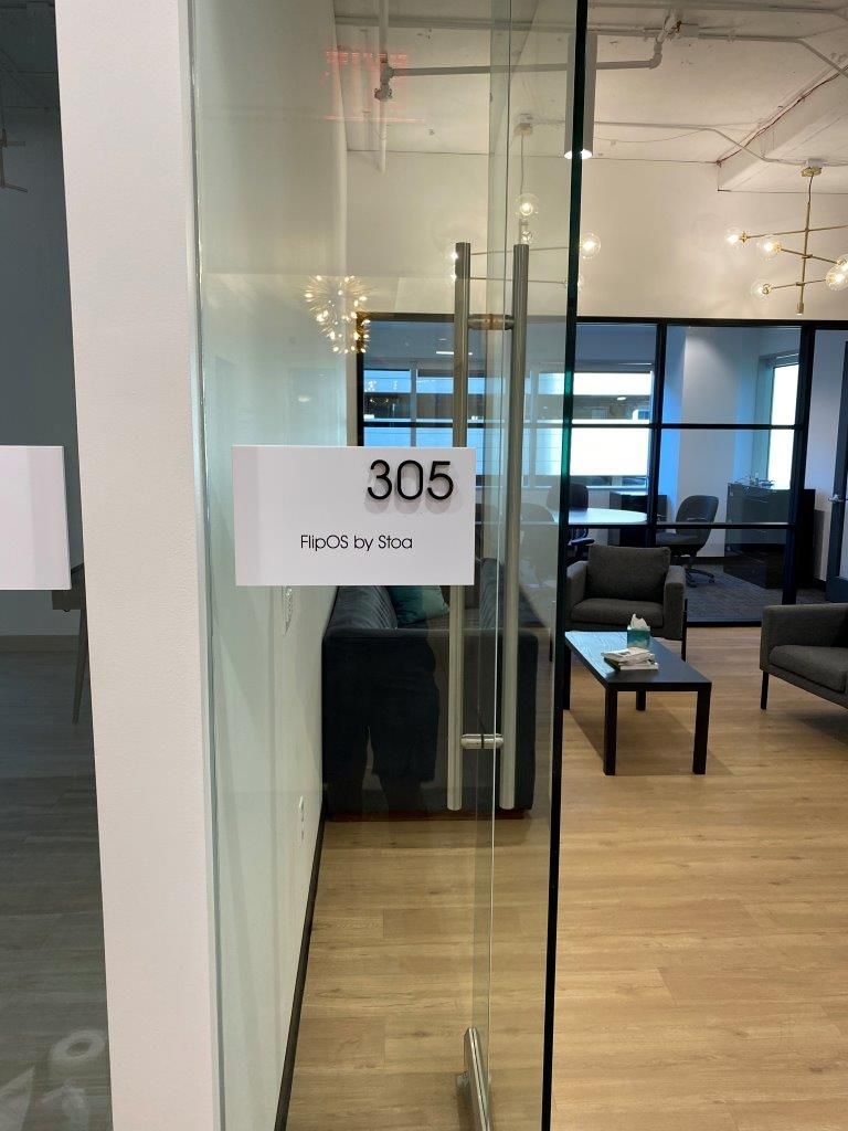 A glass door with a sign on it that says 305