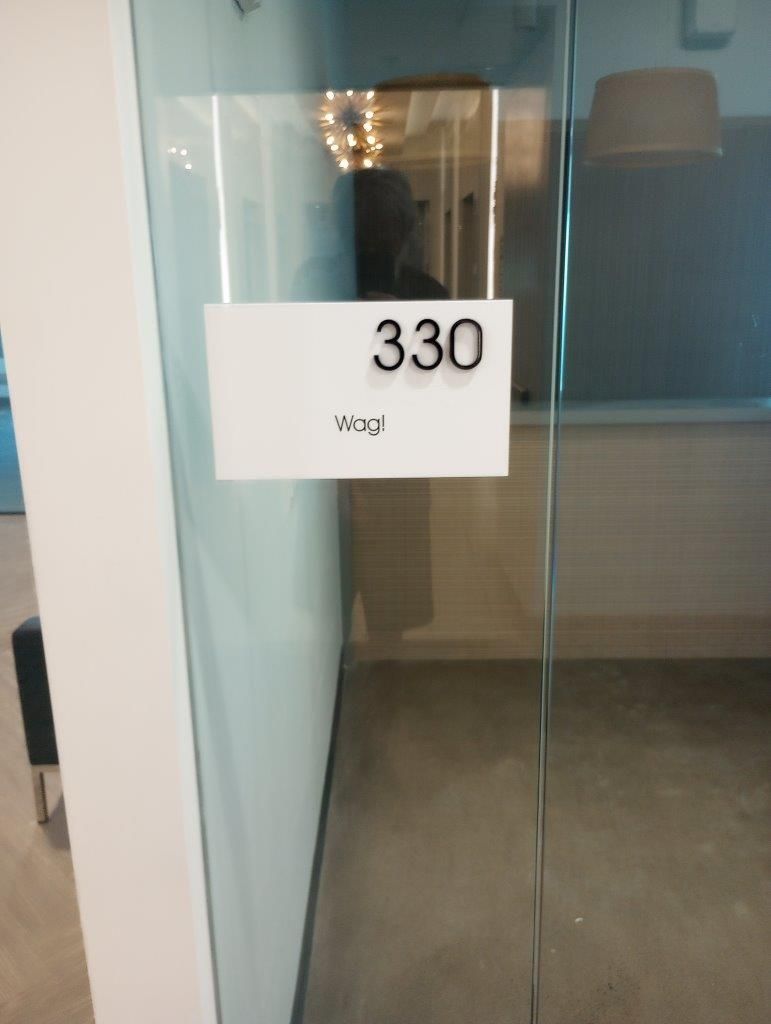 A glass door with a sign that says 330 on it