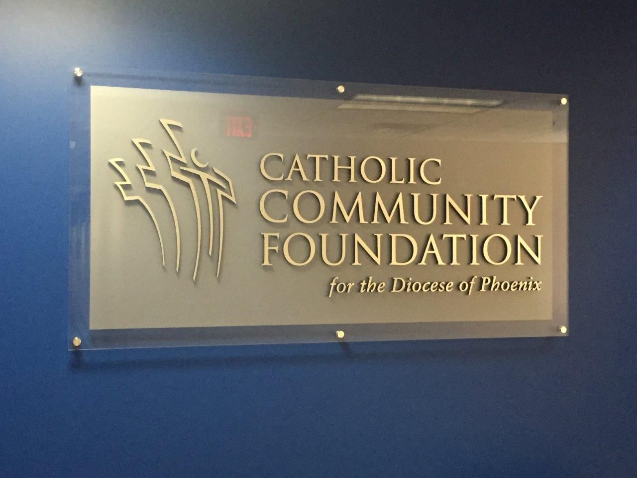 A sign that says catholic community foundation on it