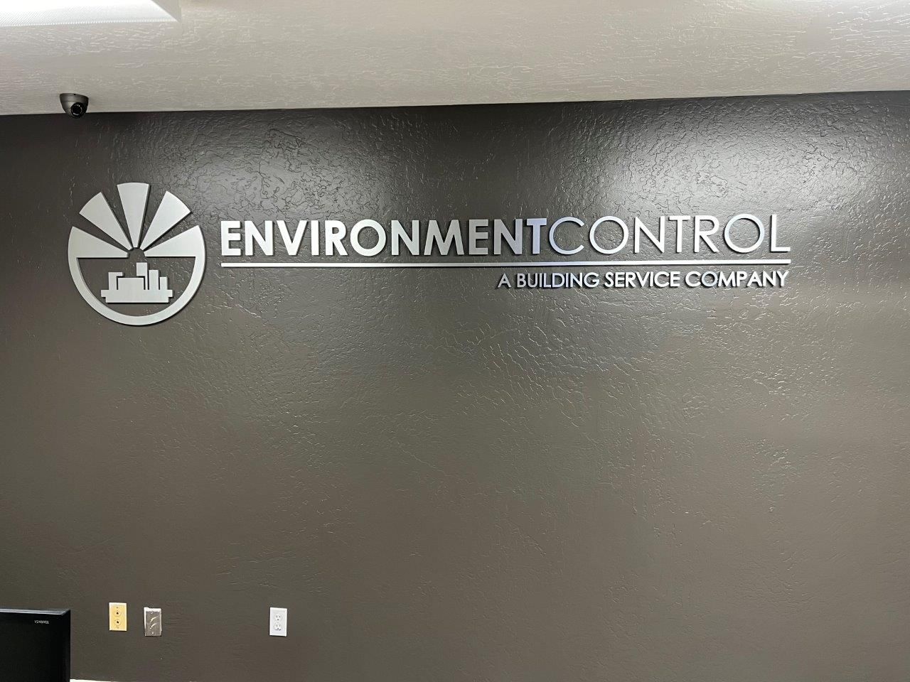 A sign on a wall that says environment control on it.