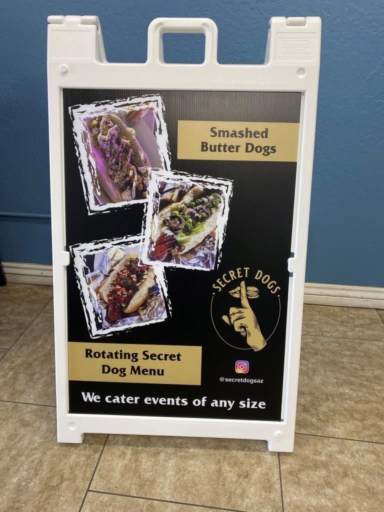 A sign that says smashed butter dogs on it