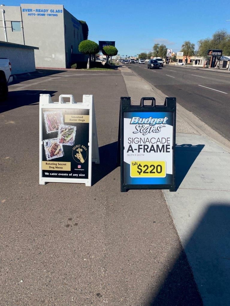 A sign on the side of the road that says $ 220