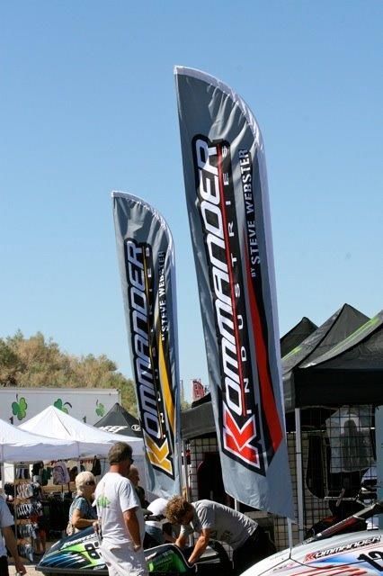 Two commander flags are flying in the wind