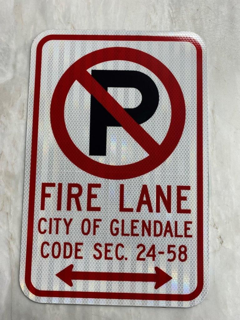 A sign that says fire lane city of glendale code sec 24 58