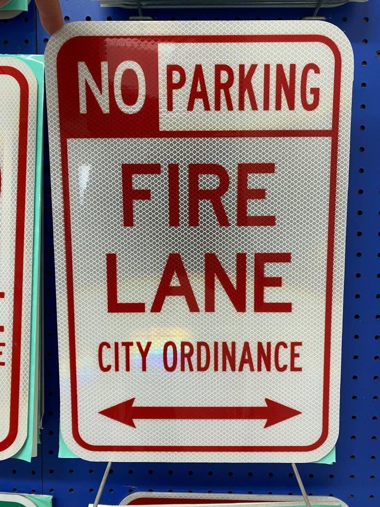 A sign that says no parking fire lane city ordinance