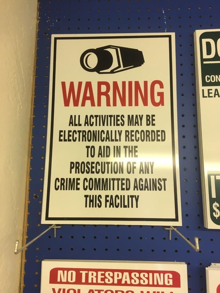 A warning sign that says all activities may be electronically recorded