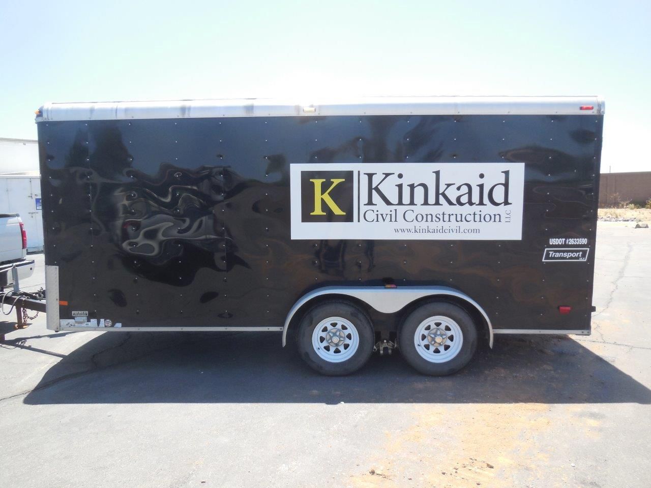 A black trailer that says kinkaid civil construction on it