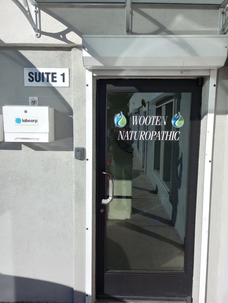 A door with a sign on it that says suite 1