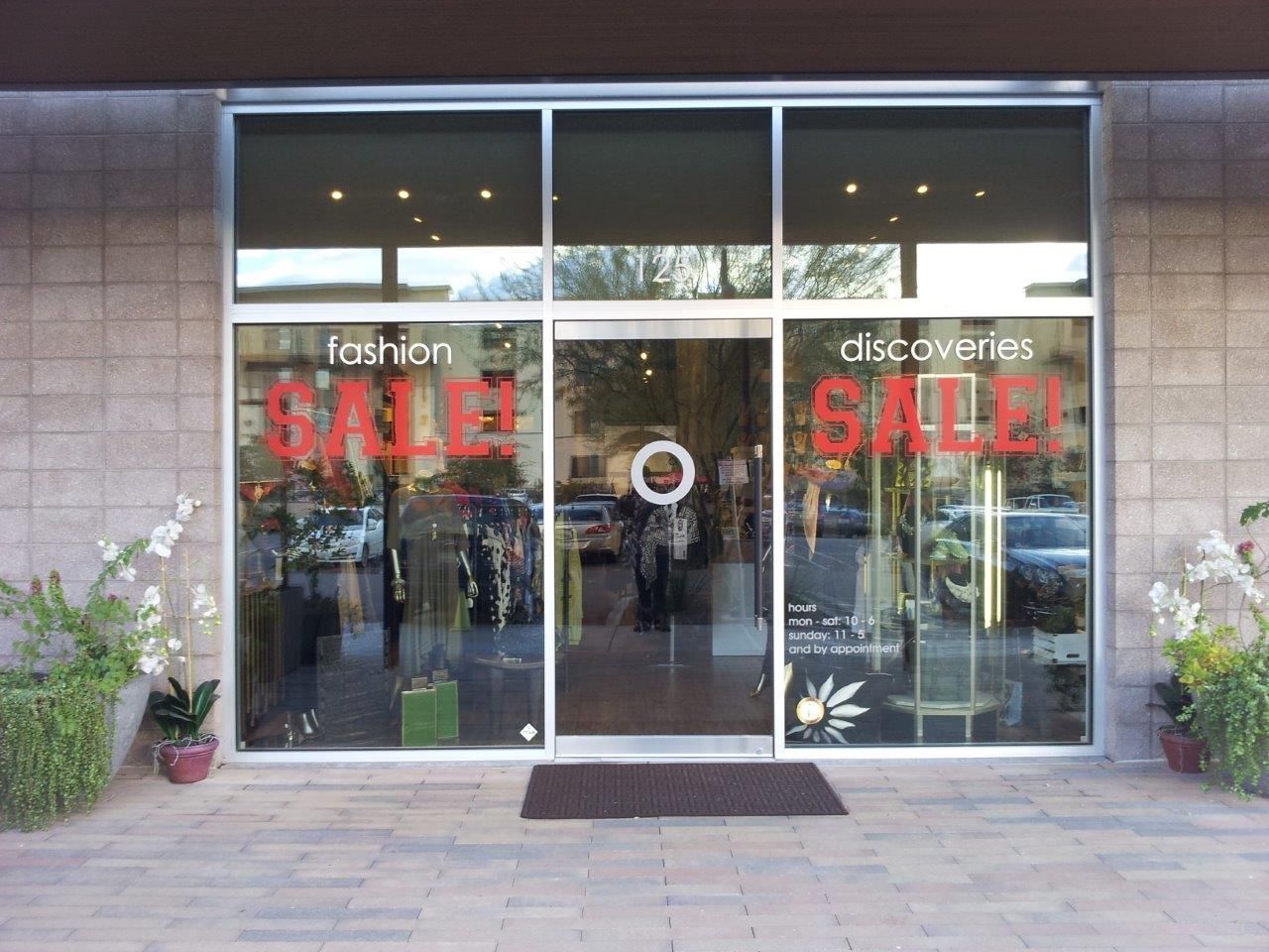 A store front with a sign that says sale