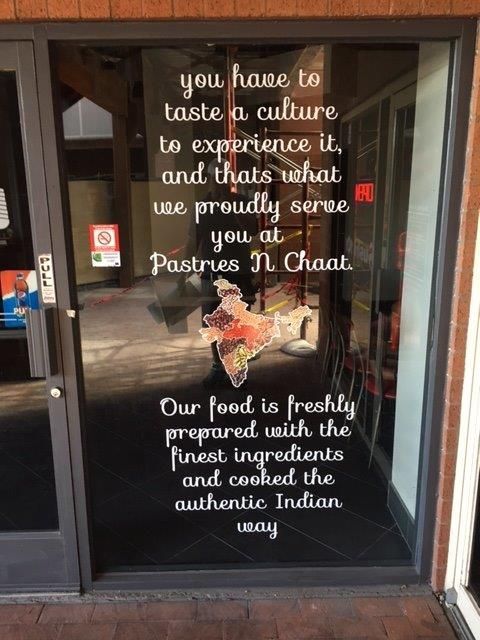 A sign that says you have to taste a culture to experience it
