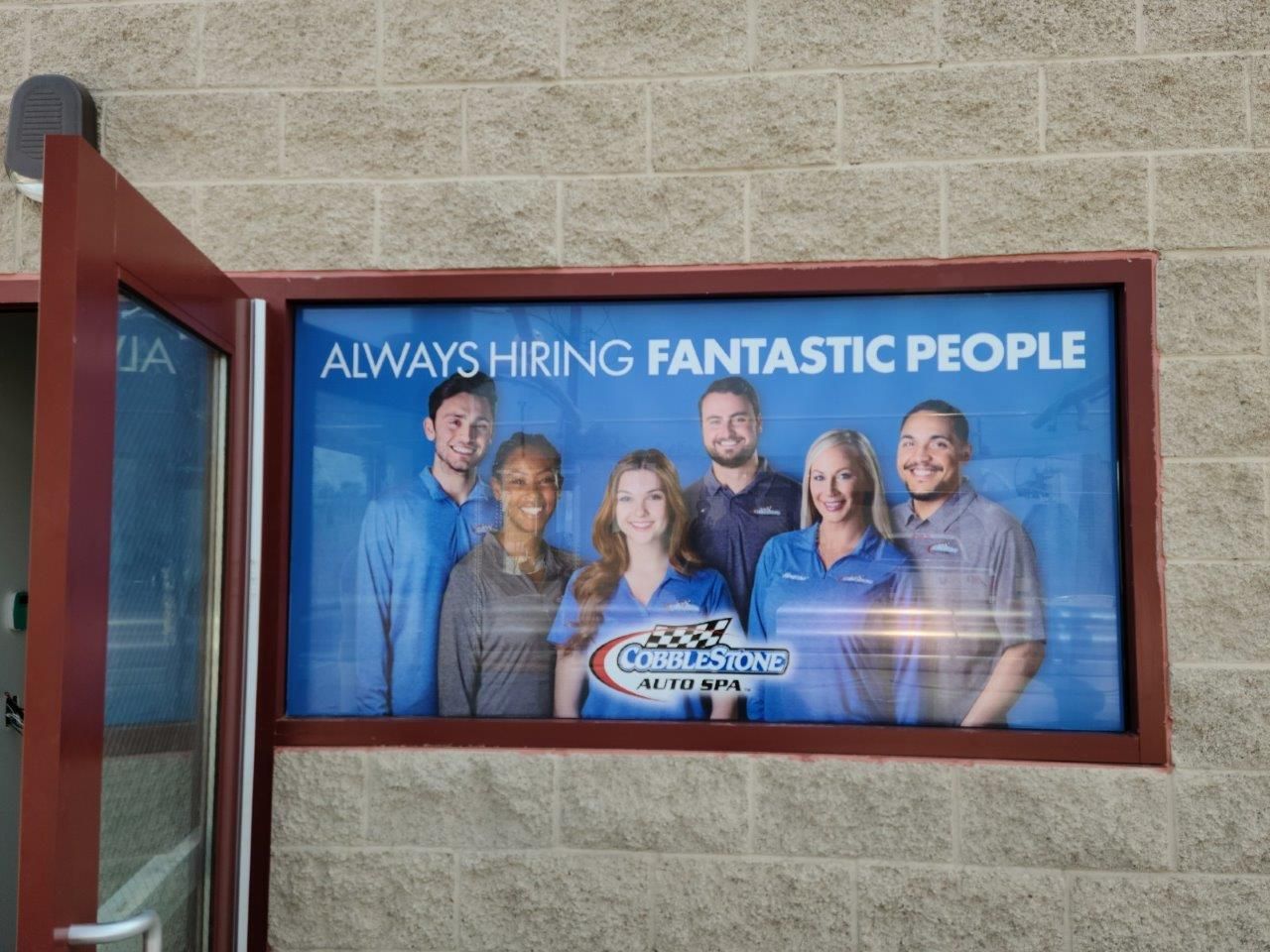 A sign that says ' always hiring fantastic people ' on it