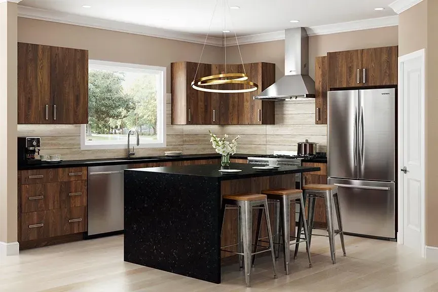 Modern kitchen with dark wood cabinets, stainless steel appliances, and black island with stools.