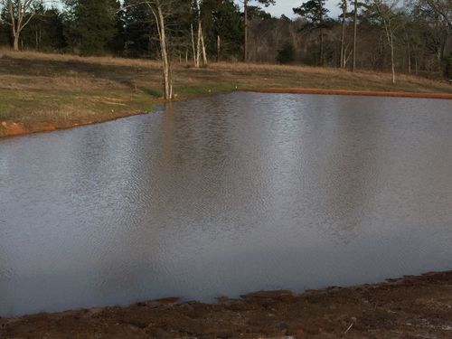 Pond and lake construction, made made pond/lake.