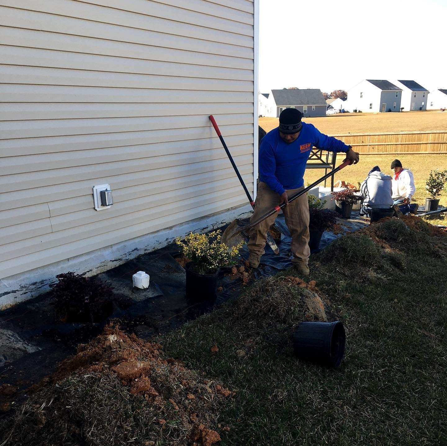 A man wearing a blue sweatshirt with the letter k on it