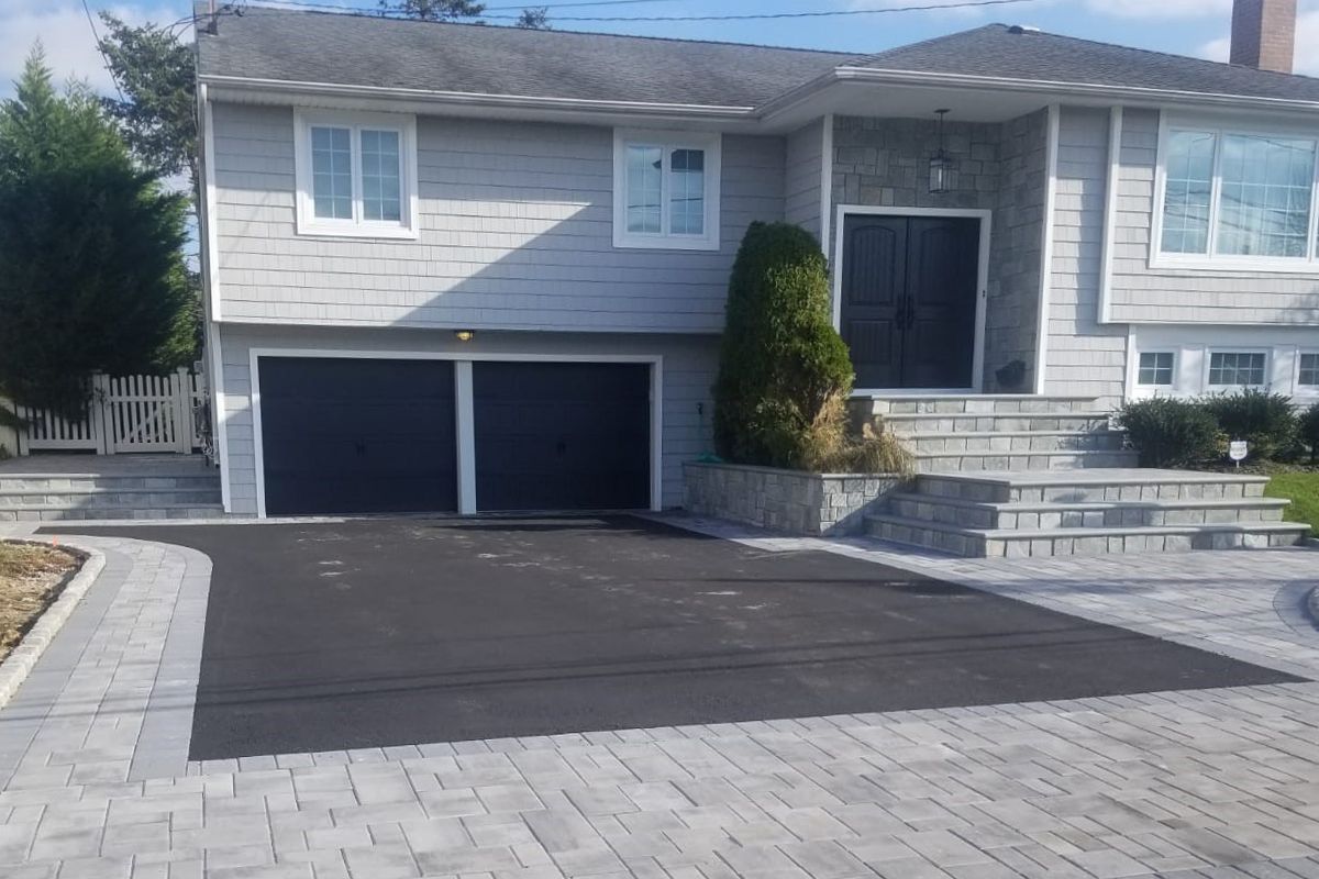 Close-up of a backyard paver installation with modern design.