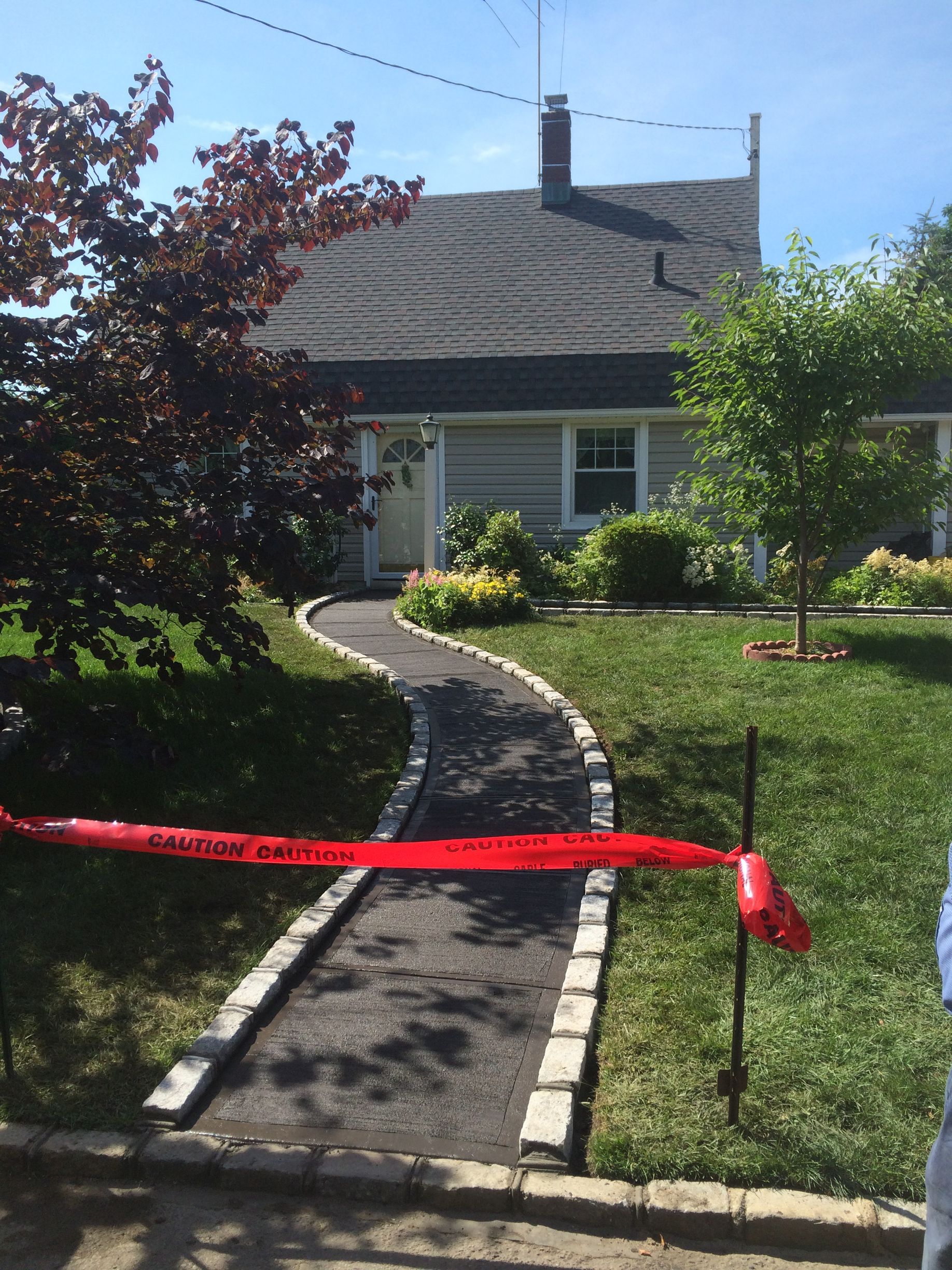 A house with a walkway in front of it