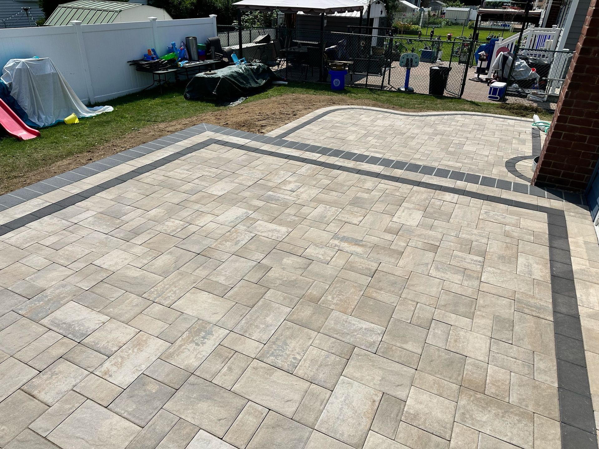 A brick walkway and pavers