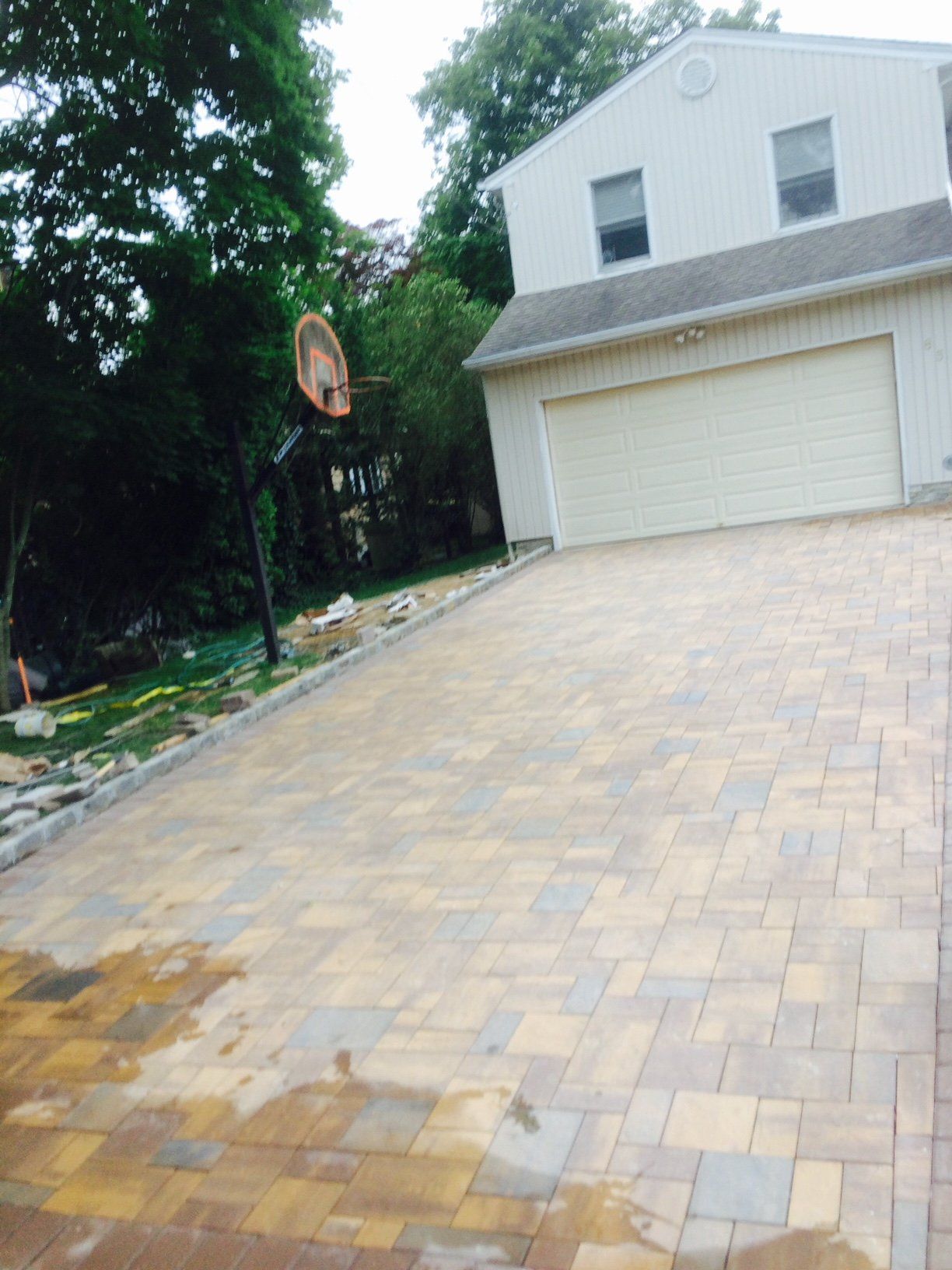 a basketball hoop in front of a garage
