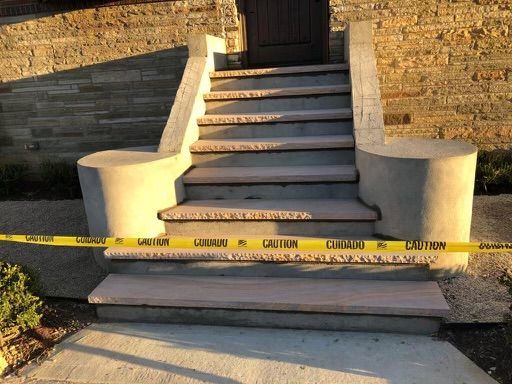 A set of stairs with a yellow caution tape around them