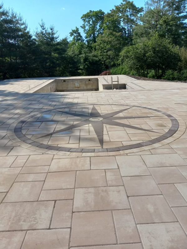 Stone patio with compass design in the center