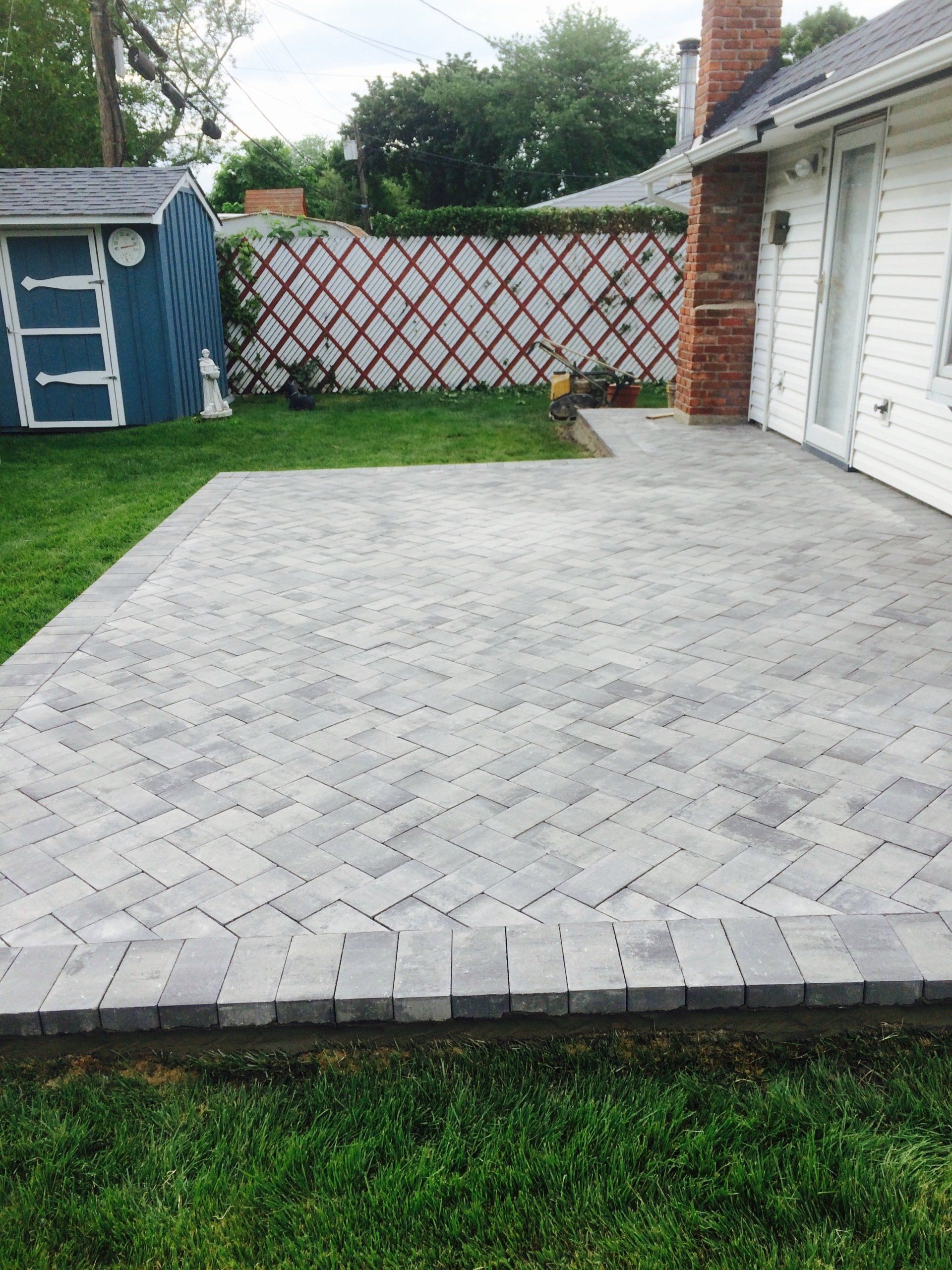 A patio beside grass