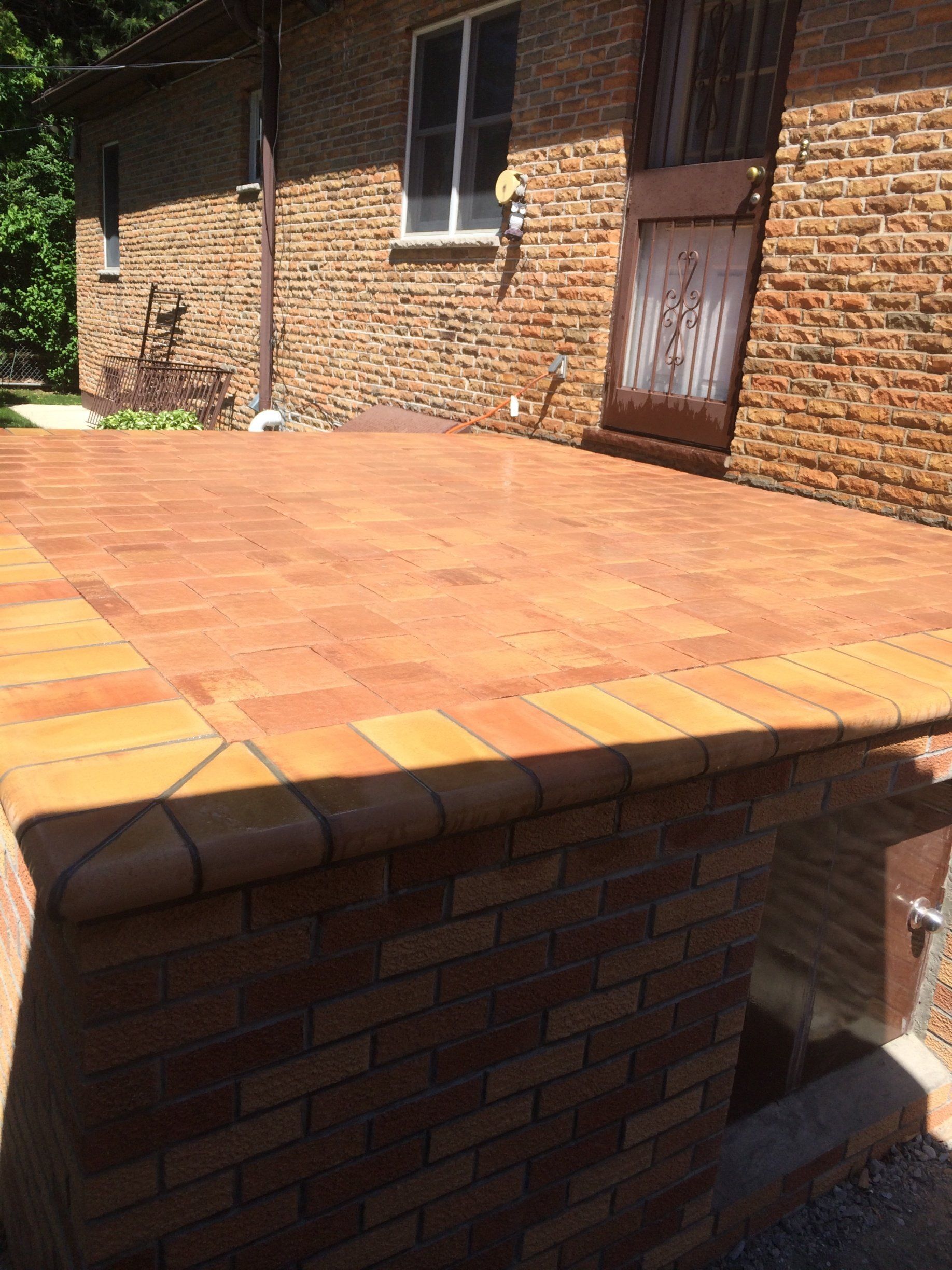Brick patio with red pattern shade